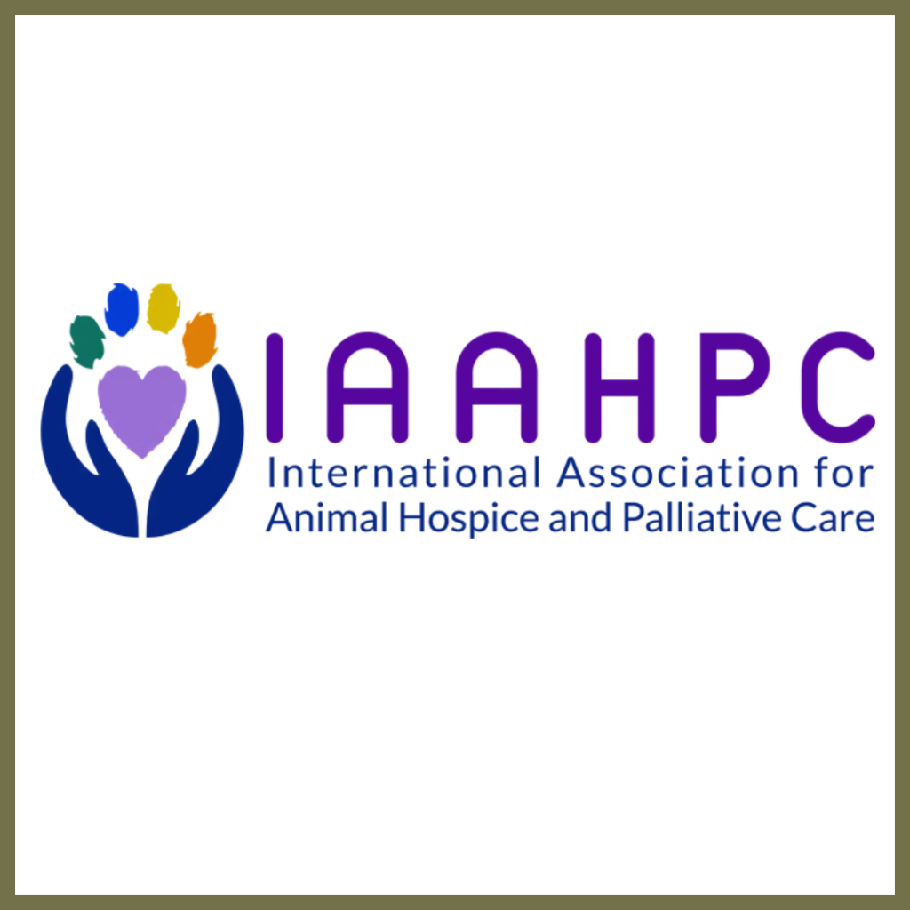 Logo for IAAHPC, the International Association for Animal Hospice and Palliative Care. It features two cupped hands cradling a purple heart, with colourful paw prints above it.